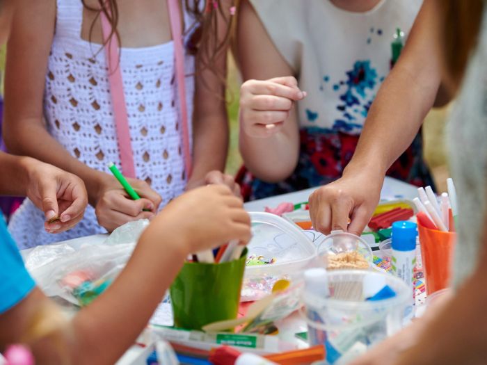 A group of girls doing easy, fun summer and fall crafts.