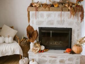 A farmhouse mantel decor done up with fall decorations from Wilco Farm Store.